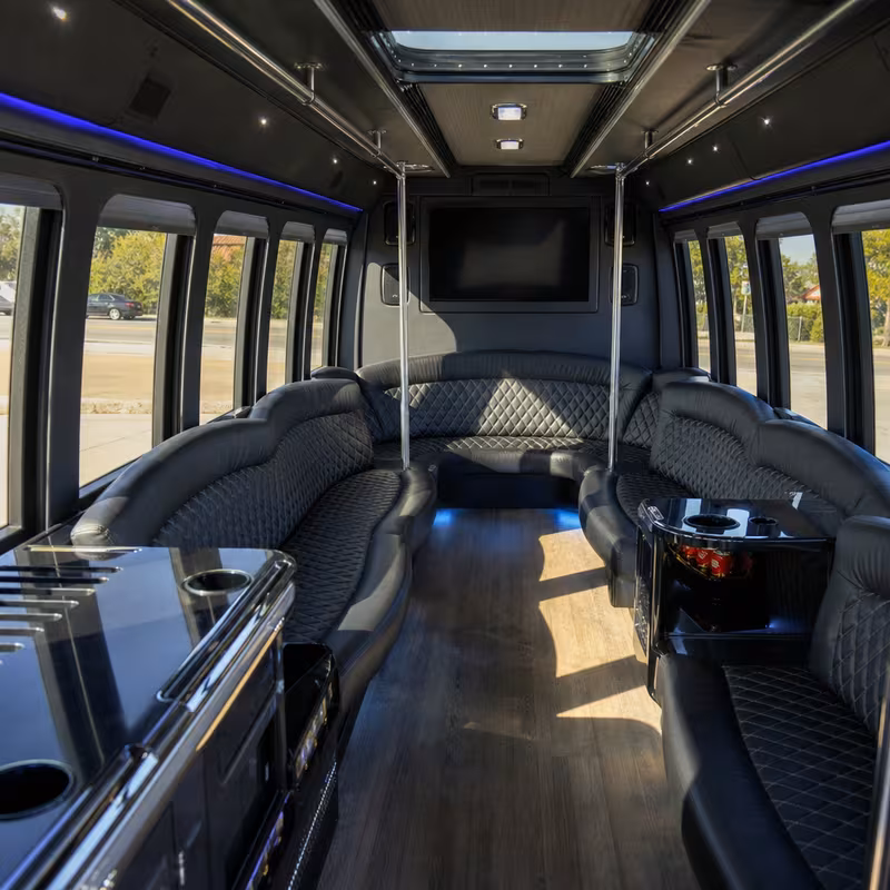 Friends laughing during a Garden Grove party bus celebration