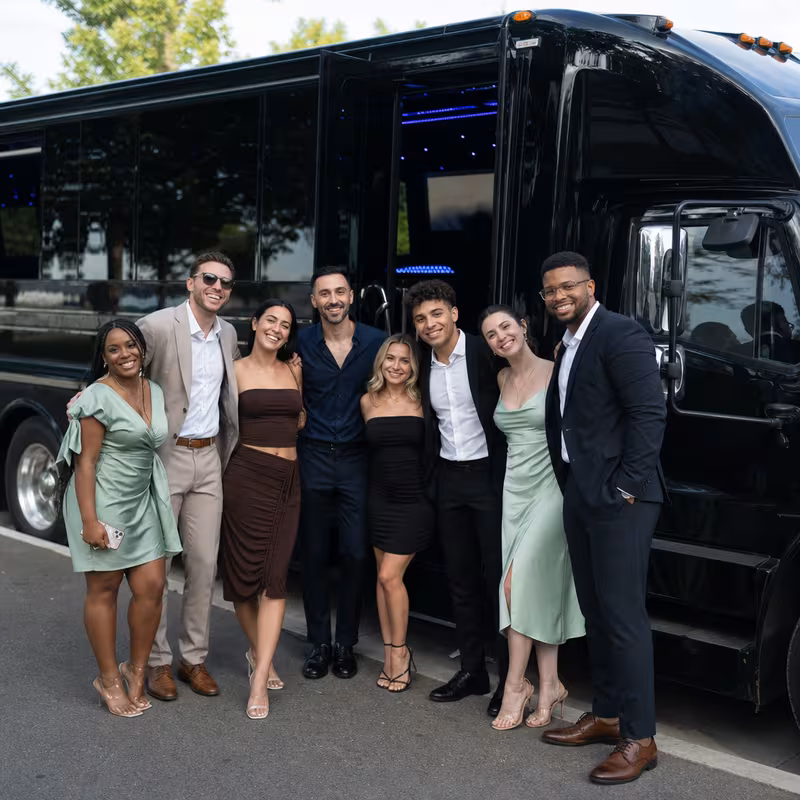 Group boarding a white charter bus for Birthday Transportation transportation in Garden Grove