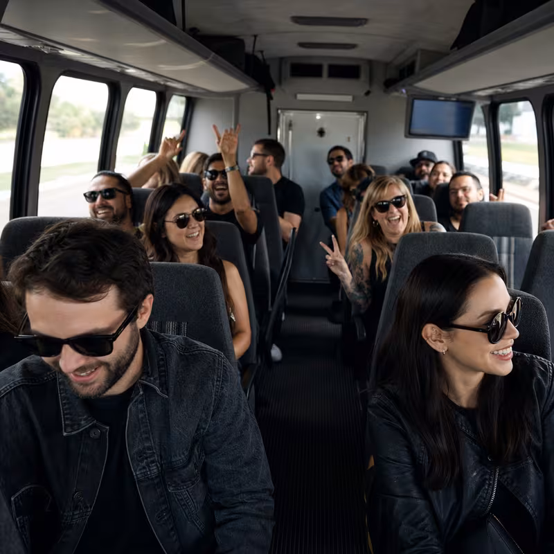 Party bus interior with wraparound leather seating and LED lighting in Garden Grove