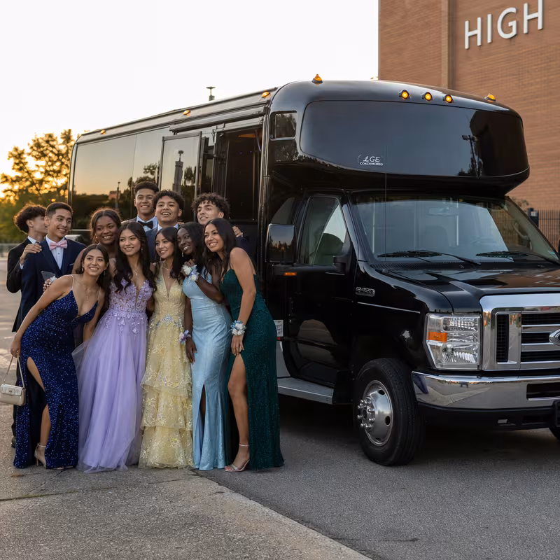 Group boarding a white charter bus for Prom & Homecoming Transportation transportation in Garden Grove