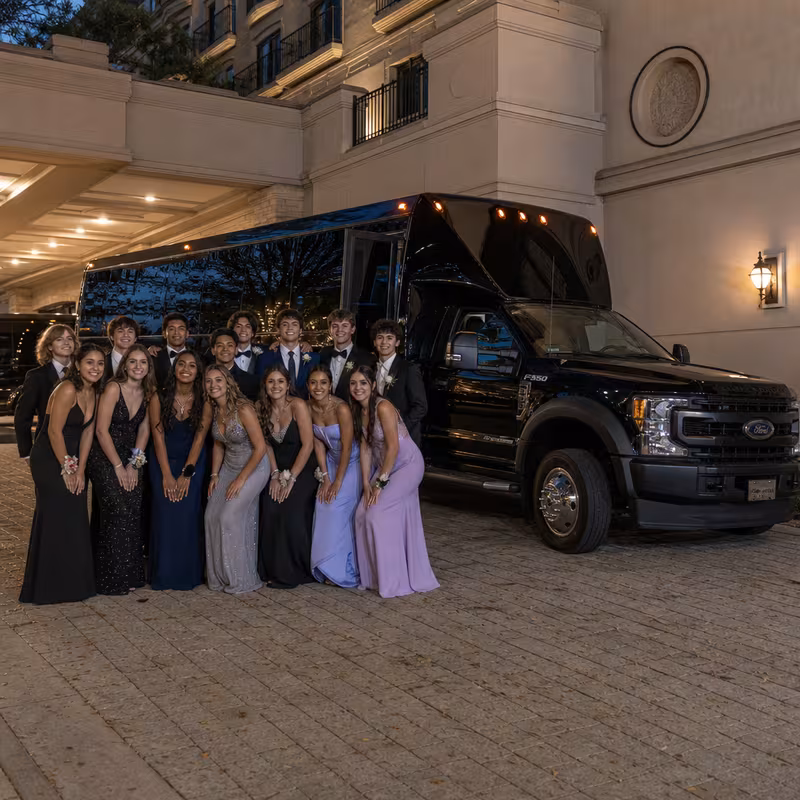 Party bus interior with wraparound leather seating and LED lighting in Garden Grove