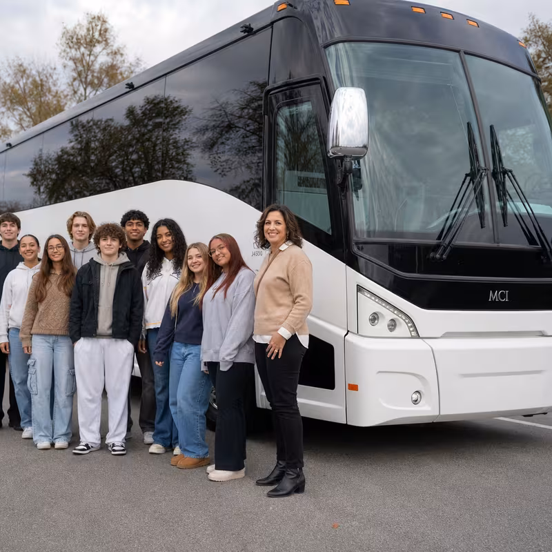 Passengers loading luggage while boarding an Garden Grove group shuttle