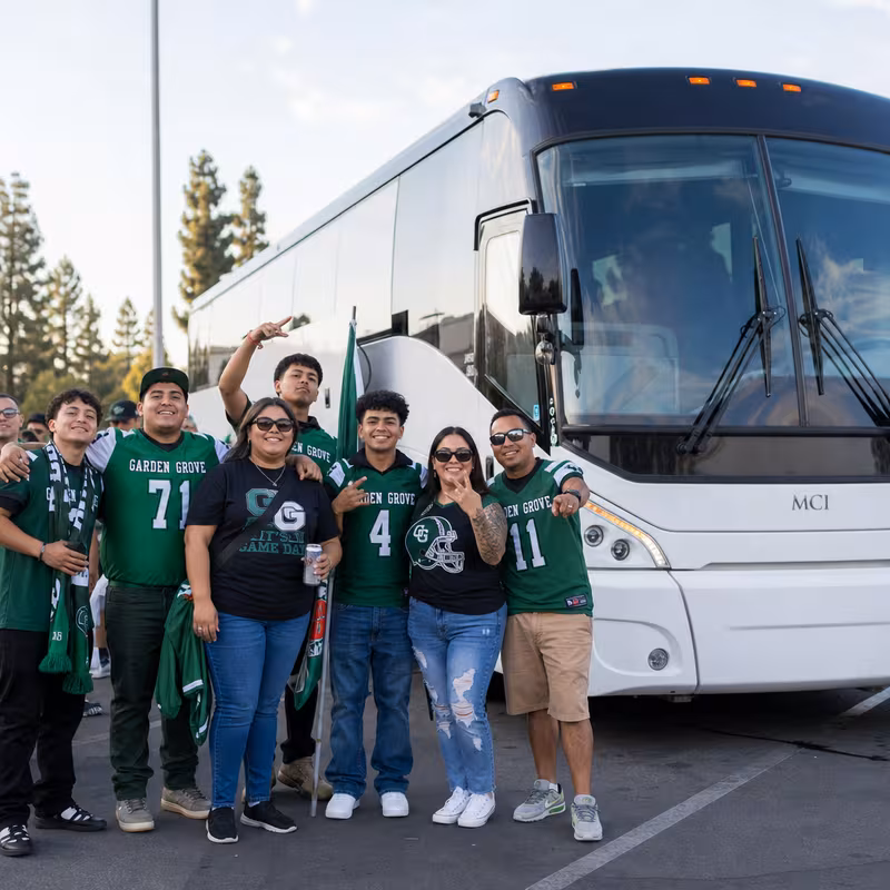 Passengers loading luggage while boarding an Garden Grove group shuttle