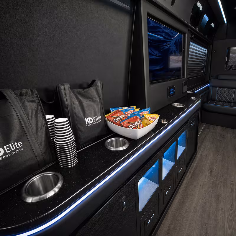 Party bus interior with wraparound leather seating and LED lighting in Garden Grove